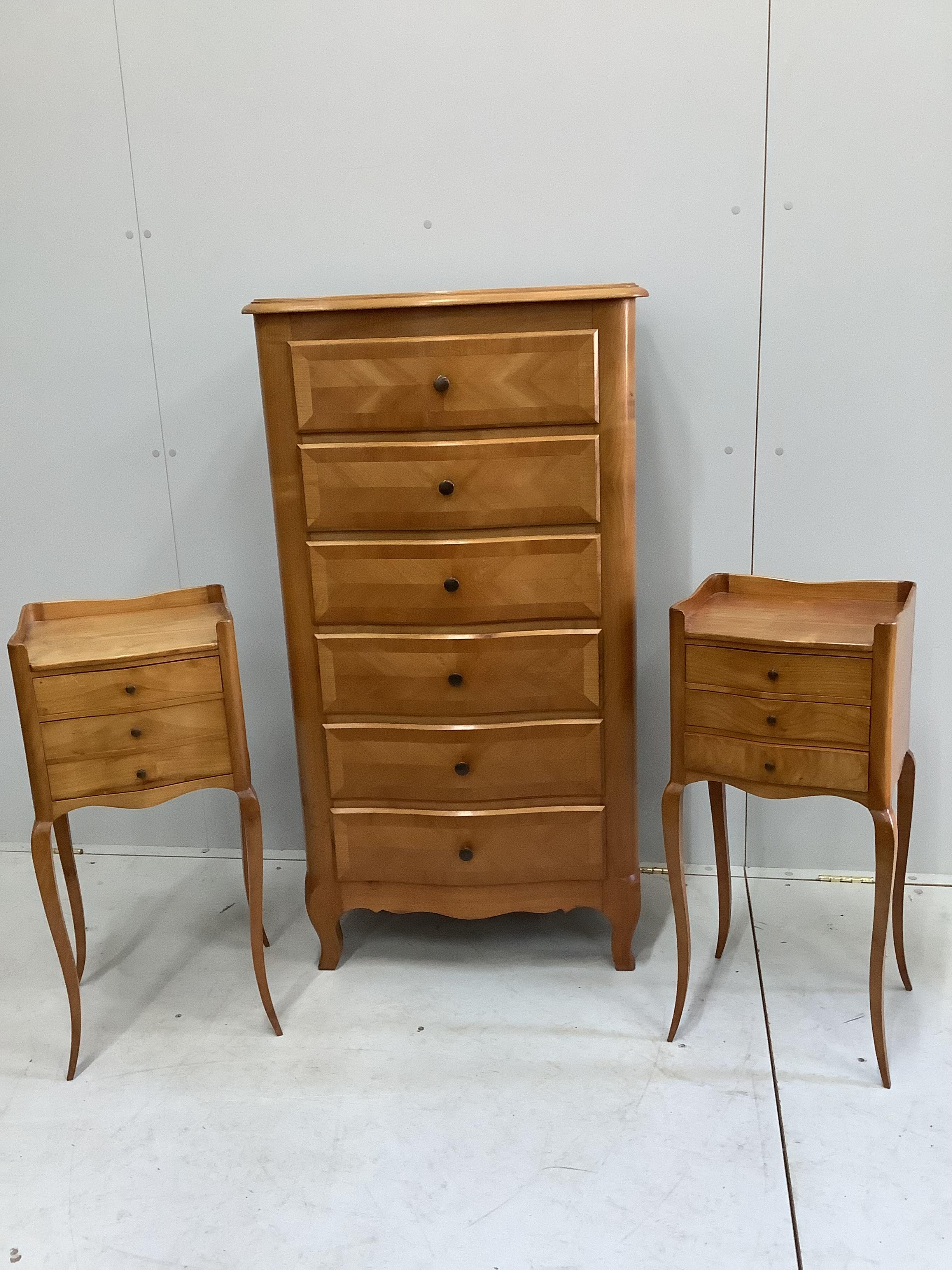 A Louis XV style serpentine six drawer chest, width 65cm, depth 39cm, height 120cm together with a pair of similar serpentine bedside chests